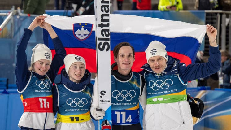 OLYMPICS - Winter Olympic Games, Olympische Spiele, Olympia, OS Milano Cortina 2026 VAL DI FIEMME,ITALY,10.FEB.26 - OLYMPICS, Ski jumping, Skispringen, Ski, nordisch - Winter Olympic Games Milano Cortina 2026, normal hill, mixed team. Image shows the rejoicing of Nika Vodan. Nika Prevc, Domen Prevc and Anze Lanisek (SLO).  GEPAxpictures xOliverxLerch