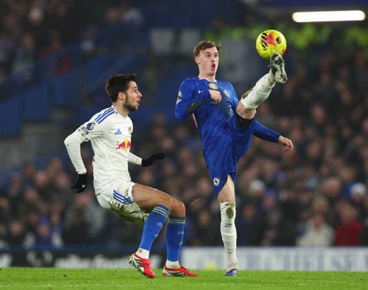 London, England, 10th February 2026. Ilia Gruev of Leeds United and Cole Palmer of Chelsea during the Chelsea vs Leeds United Premier League match at Stamford Bridge, London. Picture credit should read: Paul Terry Sportimage EDITORIAL USE ONLY. No use with unauthorised audio, video, data, fixture lists, club league logos or live services. Online in-match use limited to 120 images, no video emulation. No use in betting, games or single club league player publications. SPI_025_PT_Chelsea_v_Leeds_United SPI-4517-0026