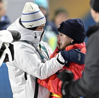Milan Cortina Olympics: Ski jumping, Skispringen, Ski, nordisch Japanese ski jumper Sara Takanashi (R) sheds tears after Japan won the mixed team bronze at the Milan Cortina Olympics on Feb. 10, 2026, at Predazzo Ski Jumping Stadium in Predazzo, Italy.  A14AA0005268319P