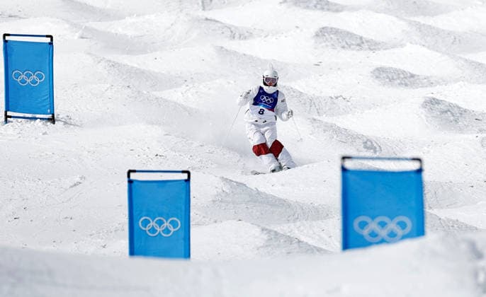 (260211) -- LIVIGNO, Feb. 11, 2026 -- Avital Carroll of Austria competes during the freestyle skiing women s moguls qualification at the Milan-Cortina 2026 Olympic Winter games, Winterspiele,Spiele, Summer games in Livigno, Italy, Feb. 11, 2026. ) (MICO2026)ITALY-LIVIGNO-OLYMPIC WINTER GAMES-FREESTYLE SKIING-WOMEN S MOGULS-QUALIFICATION WangxPeng 