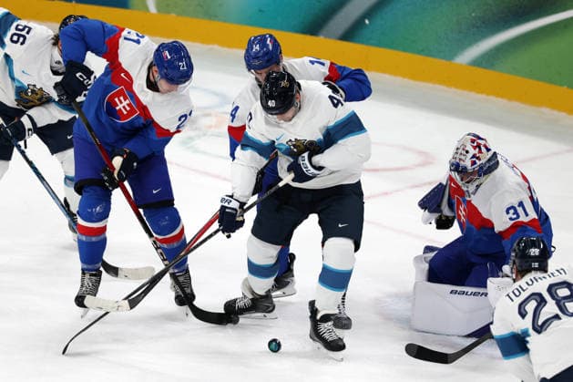 Milano Cortina 2026, Milan, Italy, 11.02, 2026, MiCo2026, MiCo, 2026, Olympics, Olympic, Winter Olympic, Olympic Winter games, Winterspiele,Spiele, Summer games Ice hockey, Eishockey Finland, Slovakia Joel Armia of Finland and Samuel Hlavaj, Adam Ruzicka of Slovakia in action during Men™s Premilinary round Group B Ice Hockey match between Slovakia and Finland teams of Milano Cortina 2026 Olympic Winter Games in Milan, Italy, 11.02.2026. Photo: Roman Koksarov (RKF) Milan Italy Copyright: xRomanxKoksarovx 0B4A0586.JPG