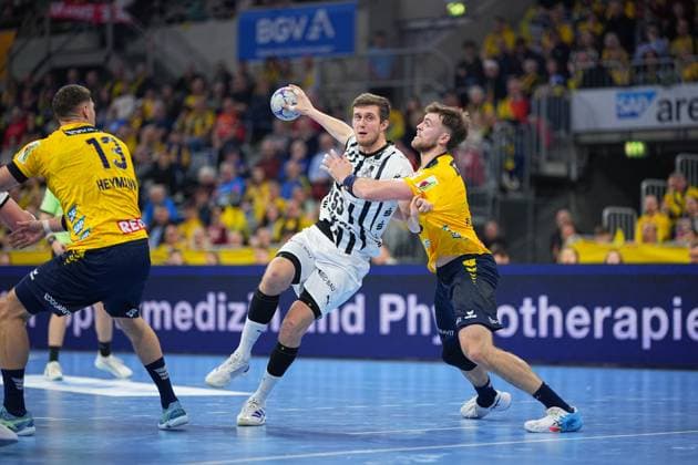 Scene with Nikola Bilyk 53 THW Kiel and Steven Plucnar Jacobsen 9 Rhein Neckar Löwen Nikola Bilyk 53 THW Kiel and Steven Plucnar Jacobsen 9 Rhein Neckar Löwen in action Copyright: xspeedshotx