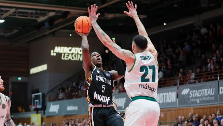In the picture from left Marcus Carr Wuerzburg Baskets, 5 against Chris Duarte Unicaja Malaga, 27 11 02 2026, Fitness First Wuerzburg Baskets vs Unicaja Malaga, Basketball Champions League, Round of 16, Group K, Matchday 4, Germany, 97072, tectake Arena Wuerzburg, Copyright: HMBxMedia xJulienxBecker