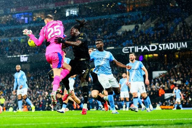 Calvin Bassey of Fulham challenges Gianluigi Donnarumma of Manchester City Manchester City v Fulham, Premier League, Football, Etihad Stadium, Manchester, UK - 11 Feb 2026Manchester Etihad Stadium United Kingdom EDITORIAL USE ONLY No use with unauthorised audio, video, data, fixture lists, club league logos or live services. Online in-match use limited to 120 images, no video emulation. No use in betting, games or single club league player publications. Copyright: xPaulxCurrie Shutterstockx 16540352de