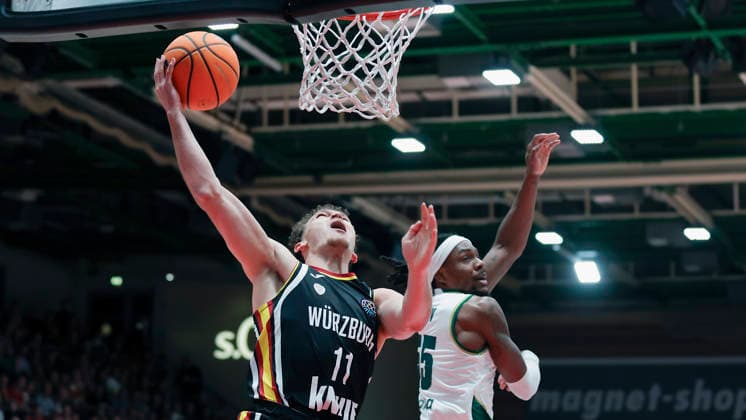 In the picture from left Brae Ivey Wuerzburg Baskets, 11 against Kendrick Perry Unicaja Malaga, 55 11 02 2026, Fitness First Wuerzburg Baskets vs Unicaja Malaga, Basketball Champions League, Round of 16, Group K, Matchday 4, Germany, 97072, tectake Arena Wuerzburg, Copyright: HMBxMedia xJulienxBecker
