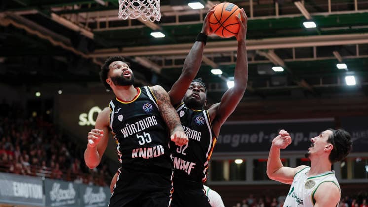 In the picture from left David Muenkat Wuerzburg Baskets, 55 watches as Charles Thompson Wuerzburg Baskets, 32 grabs the rebound and next to him Nihad Dedovic Unicaja Malaga, 14 11 02 2026, Fitness First Wuerzburg Baskets vs Unicaja Malaga, Basketball Champions League, Round of 16, Group K, Matchday 4, Germany, 97072, tectake Arena Wuerzburg, Copyright: HMBxMedia xJulienxBecker