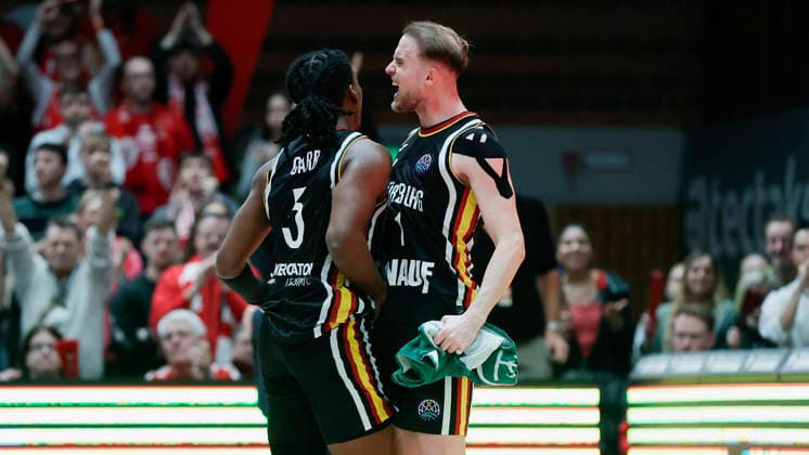 In the picture Marcus Carr Wuerzburg Baskets, 5 and Lukas Herzog Wuerzburg Baskets, 1 11 02 2026, Fitness First Wuerzburg Baskets vs Unicaja Malaga, Basketball Champions League, Round of 16, Group K, Matchday 4, Germany, 97072, tectake Arena Wuerzburg, Copyright: HMBxMedia xJulienxBecker