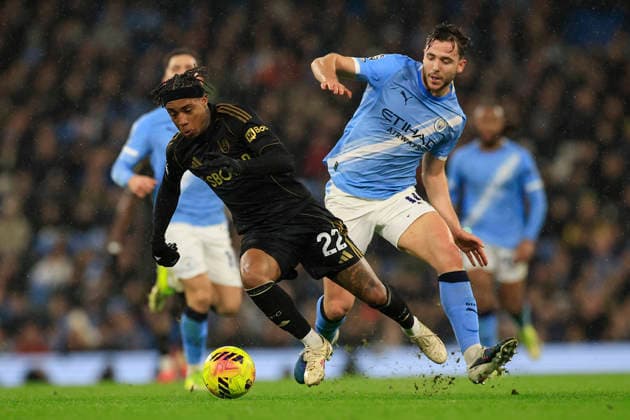 Manchester City v Fulham, Premier League Nico Gonzalez (14) of Manchester City gets a yellow card for this foul on Kevin (22) of Fulham during the Premier League match between Manchester City and Fulham at the Etihad Stadium, Manchester, UK on 11 February 2026. Manchester Etihad Stadium Manchester UK Editorial use only DataCo restrictions apply See www.football-dataco.com , Copyright: xConorxMolloyx PSI-23725-0057
