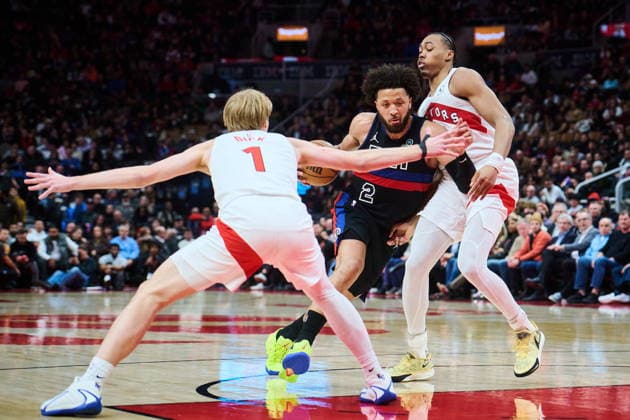 February 11, 2026, Toronto, On, Canada: Detroit Pistons Cade Cunningham (2) drives through Toronto Raptors Gradey Dick (1), left, and Scottie Barnes (4) during second half NBA, Basketball Herren, USA basketball action in Toronto, on Wednesday, Feb. 11, 2026. Canada News - February 11, 2026  - ZUMAc35_ 20260211_zaf_c35_311 Copyright: xSammyxKoganx