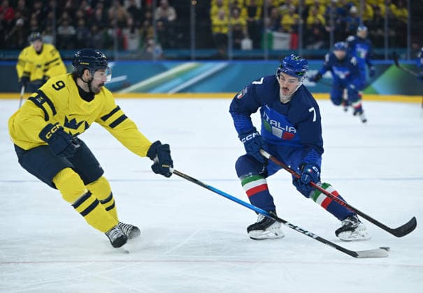 (260212) -- MILAN, Feb. 12, 2026 -- Alessandro Segafredo (R) of Italy breaks through during the Ice hockey, Eishockey men s preliminary round group B match between Italy and Sweden at the Milan-Cortina 2026 Olympic Winter games, Winterspiele,Spiele, Summer games in Milan, Italy, Feb. 11, 2026. ) (MICO2026)ITALY-MILAN-OLYMPIC WINTER GAMES-ICE HOCKEY-MEN-PRELIMINARY-ITA VS SWE ZhangxHaofu 