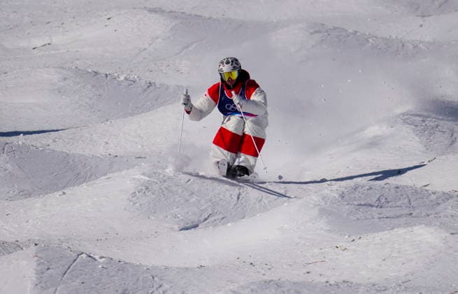 February 12, 2026, Livigno, Italy: Elliot Vaillancourt from Drummondville, Que., competes in the men s moguls qualification two at the Milano Cortina 2026 Winter Olympic Games, Olympische Spiele, Olympia, OS in Livigno, Italy on Thursday, Feb. 12, 2026. Canada News - February 12, 2026  - ZUMAc35_ 20260212_zaf_c35_001 Copyright: xSeanxKilpatrickx