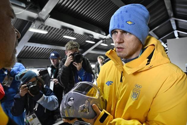 Milan Cortina Olympics: Ukrainian athlete disqualified from games Ukrainian skeleton racer Vladyslav Heraskevych meets the press in Cortina d Ampezzo, Italy, on Feb. 12, 2026, after being disqualified from competition at the Milan Cortina Olympics for pledging to wear a helmet displaying images of athletes who were killed during Russian attacks on Ukraine.  A14AA0005274195P