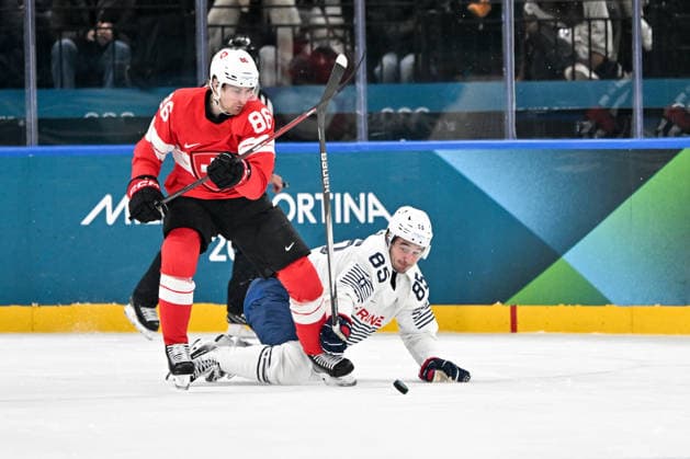 MILAN, ITALY - FEBRUARY 12: Janis Moser of Switzerland in a battle for the puck against Alexandre Texier of France on day six of the Milano Cortina 2026 Winter Olympic Games, Olympische Spiele, Olympia, OS at Milano Santagiulia Ice hockey, Eishockey Arena on February 12, 2026 in Milan, Italy. Milan Milano Rho Ice Hockey Arena Italy *** MILAN, ITALY FEBRUARY 12 Janis Moser of Switzerland in a battle for the puck against Alexandre Texier of France on day six of the Milano Cortina 2026 Winter Olympic games at Milano Santagiulia Ice Hockey Arena on February 12, 2026 in Milan, Italy Milan Milano Rho Ice Hockey Arena Italy Copyright: xJustPictures.ch AndreaxBrancax jp-en-EuSpIm-AB-DSC_832212022026
