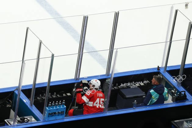 February 12, 2026, Milan, Lombardy, Italy: MICHAEL FORA 45 of Switzerland in the penalty box in the Men s Preliminary Round Group A game between Team Switzerland (SUI) and Team France (FRA) at the Milano Cortina 2026 Winter Olympic Games, Olympische Spiele, Olympia, OS Milan Italy - ZUMAc179 20260212_oly_c179_029 Copyright: xMickaelxChavetx