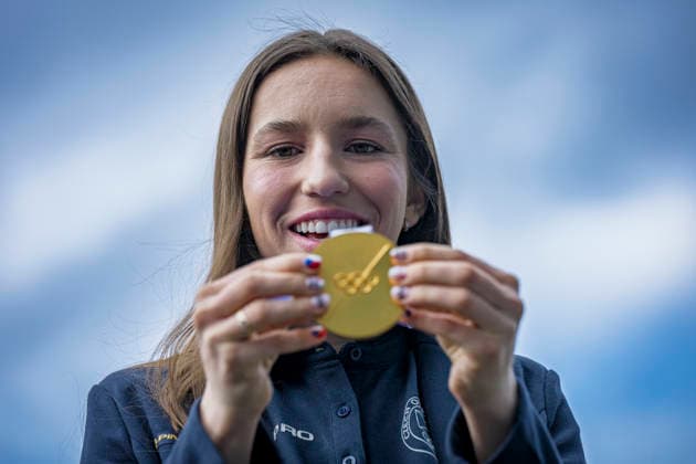 Olympic winner in snowboard parallel giant slalom Zuzana Maderova shows her gold medal during a meeting with the Governor of the Liberec Region Martin Puta, in Liberec, Czech Republic, on February 12, 2026. (CTKxPhoto RadekxPetrasek) CTKPhotoP2026021207333  CTKPhotoP2026021207333