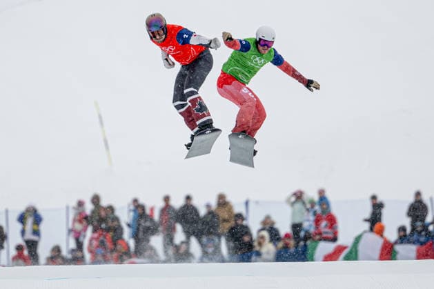 XXV Winter Olympic Games, Olympische Spiele, Olympia, OS in Livigno, Italy, on February 12, 2026. Snowboard Men s Snowboard Cross 1 8 Finals. From left Eliot Grondin of Canada, Kalle Koblet of Switzerland. (CTKxPhoto DavidxTanecek) CTKPhotoP2026021207438  CTKPhotoP2026021207438