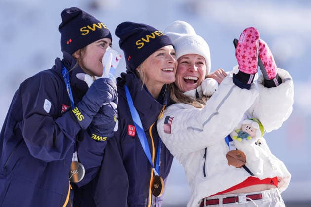 2026 Winter Olympic Games, Olympische Spiele, Olympia, OS MILAN, ITALY - FEBRUARY 12: Swedish athletes Frida Karlsson (C), Ebba Andersson (L) and Jessie Diggins of US celebrate after winning golden, silver and bronz medal respectively in the women’s 10 km freestyle cross-country skiing at the Milano–Cortina 2026 Winter Olympic Games in Milan, Italy on February 12, 2026. Cemal Yurttas Anadolu Milan Italy. Editorial use only. Please get in touch for any other usage.  Copyright: x2026xAnadoluxCemalxYurttasx