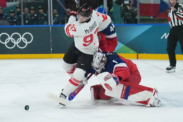 February 12, 2026, Milan, ITALY: Lukas Dostal (1) of Team Czechia makes a save on Connor McDavid (97) of Team Canada during first period men s Olympic hockey action at the 2026 Milan Cortina Winter Olympics in Milan, Italy on Thursday, February 12, 2026. Canada News - February 12, 2026  - ZUMAc35_ 20260212_zaf_c35_087 Copyright: xNathanxDenettex