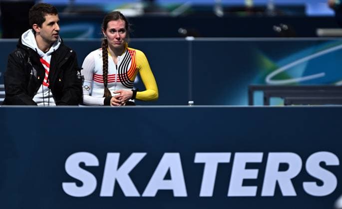 Speed skating, Eisschnelllauf coach Daniel Greig and Belgian speed skater Sandrine Tas react after the Women s 5000m speed skating race at the Milano Cortina 2026 Olympic Winter games, Winterspiele,Spiele, Summer games on Thursday 12 February 2026 in Milan, Italy. The XXV Winter Olympics take place from 6 to 22 February 2026 in Italy. JASPERxJACOBS  x162943575x