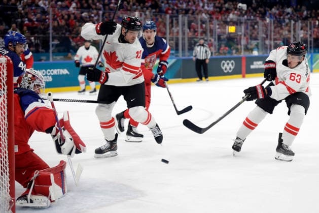 Milano Cortina 2026, Milan, Italy, 12.02, 2026, MiCo2026, MiCo, 2026, Olympics, Olympic, Winter Olympic, Olympic Winter games, Winterspiele,Spiele, Summer games Ice hockey, Eishockey Canada, Czechia Brad Marchand and Sam Reinhart of Canada in action against Lukas Dostal of Czechia during men™s Premilinary round Group A Ice Hockey match between Canada and Czechia teams of Milano Cortina 2026 Olympic Winter Games in Milan, Italy, 12.02.2026. Photo: Roman Koksarov (RKF) Milan Italy Copyright: xRomanxKoksarovx _23A3324.JPG