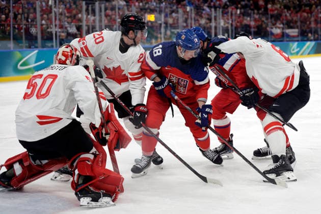 Milano Cortina 2026, Milan, Italy, 12.02, 2026, MiCo2026, MiCo, 2026, Olympics, Olympic, Winter Olympic, Olympic Winter games, Winterspiele,Spiele, Summer games Ice hockey, Eishockey Canada, Czechia Jordan Binnington , Thomas Harley both of Canada and Ondrej Palat of Czechia in action during men™s Premilinary round Group A Ice Hockey match between Canada and Czechia teams of Milano Cortina 2026 Olympic Winter Games in Milan, Italy, 12.02.2026. Photo: Roman Koksarov (RKF) Milan Italy Copyright: xRomanxKoksarovx _23A3446.JPG