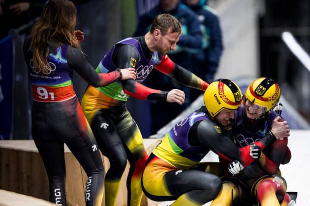 CORTINA, ITALY - FEBRUARY 12: Julia Taubitz (Germany), Tobias Wendl Tobias Arlt (Germany), Max Langenhan (Germany), Dajana Eitberger Magdalena Matschina (Germany) hug after winning Gold during the Luge Team Relay at the Milano Cortina 2026 Olympics at Cortina Sliding Centre on day 6 of the Milano Cortina 2026 Olympics on February 12, 2026 in Cortina, Italy. Editorial use only. Italy Copyright: xSteffiexWunderlx