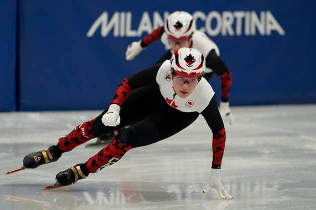 Courtney Sarault, 14, of Canada races ahead during the Women s Short Track Speed skating, Eisschnelllauf 500m Quarter-Finals at the Milano Figure skating, Eiskunstlauf Arena in Milan, Italy on Tuesday, February 12, 2026.  OLY20260212104 RichardxEllis