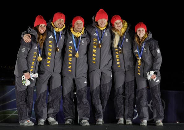 Germany s Luge relay team celebrate winning gold at the 2026 Winter Olympics in Cortina, Italy on Thursday February 12, 2026. The USA placed fourth.  OLY20260212655 HUGOxPHILPOTT