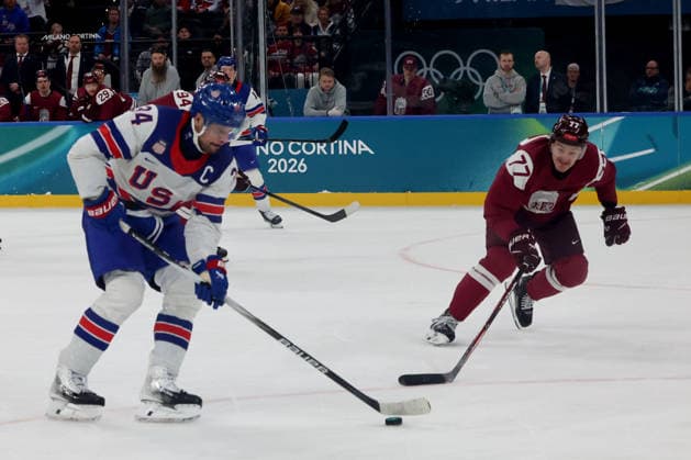 February 12, 2026, Milan, Lombardy, Italy: Auston Matthews 34 of Team United States and Kristaps Zile 77 of Team Latvia in men s Ice hockey, Eishockey group C play during the Milano Cortina 2026 Olympic Winter games, Winterspiele,Spiele, Summer games at Milano Santagiulia Ice Hockey Arena Olympics 2026: Milano Cortina: Ice Hockey Men - Group C - LAT-USA  - ZUMAm117 20260212_oly_m117_042 Copyright: xDavidxMcIntyrex