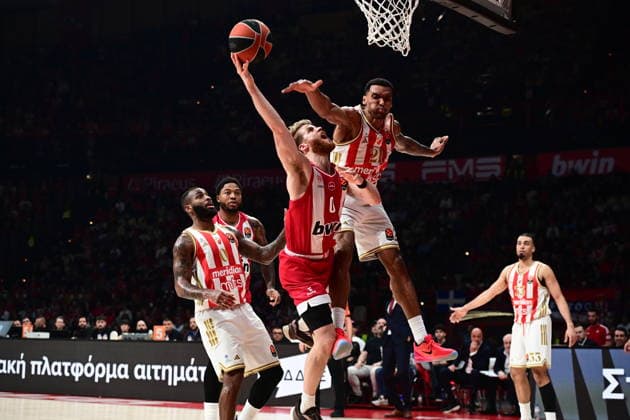 EuroLeague Basketball, Olympiacos Piraeus vs Crvena Zvezda Meridianbet Belgrade - Thomas Walkup, 0 of Olympiacos Piraeus in action against Joel Bolomboy, 21 of Crvena Zvezda Meridianbet Belgrade during the Euroleague regular season basketball match between Olympiacos Piraeus and Crvena Zvezda Meridianbet Belgrade held at Peace and Friendship Stadium in Piraeus, Grecee, 13 February 2026. PIRAEUS Greece Copyright: xOnexInchxProductionsx 6849721