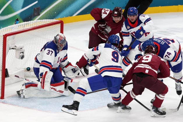 Milano Cortina 2026, Milan, Italy, 12.02, 2026, MiCo2026, MiCo, 2026, Olympics, Olympic, Winter Olympic, Olympic Winter games, Winterspiele,Spiele, Summer games Ice hockey, Eishockey Latvia, USA, United States Renars Krastenbergs of Latvia scores against Connor Hellebuyck of United States during men™s Premilinary round Group C Ice Hockey match between Latvia and USA teams of Milano Cortina 2026 Olympic Winter Games in Milan, Italy, 12.02.2026. Photo: Roman Koksarov (RKF) Milan Italy Copyright: xRomanxKoksarovx 0B4A2257.JPG