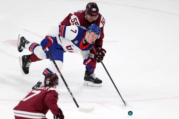 Milano Cortina 2026, Milan, Italy, 12.02, 2026, MiCo2026, MiCo, 2026, Olympics, Olympic, Winter Olympic, Olympic Winter games, Winterspiele,Spiele, Summer games Ice hockey, Eishockey Latvia, USA, United States Roberts Mamcics of Latvia and Brady Tkachuk of United States in action during men™s Premilinary round Group C Ice Hockey match between Latvia and USA teams of Milano Cortina 2026 Olympic Winter Games in Milan, Italy, 12.02.2026. Photo: Roman Koksarov (RKF) Milan Italy Copyright: xRomanxKoksarovx 0B4A2550.JPG