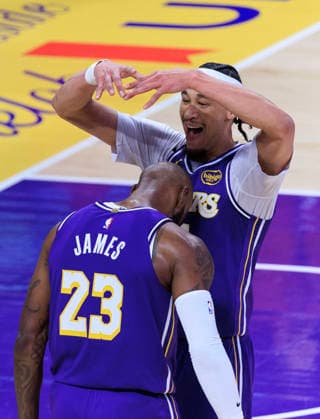 February 12, 2026, Los Angeles, California, USA: Jaxson Hayes 11 of the Los Angeles Lakers crowns LeBron James 23 after a successful three pointer during their regular season NBA, Basketball Herren, USA game against the Dallas Mavericks on Thursday February 12, 2026 at Crypto.com Arena in Los Angeles, California. ARIANA RUIZ PI Lakers Vs. Mavericks  - ZUMAp124 20260212_zaa_p124_048 Copyright: xArianaxRuizx