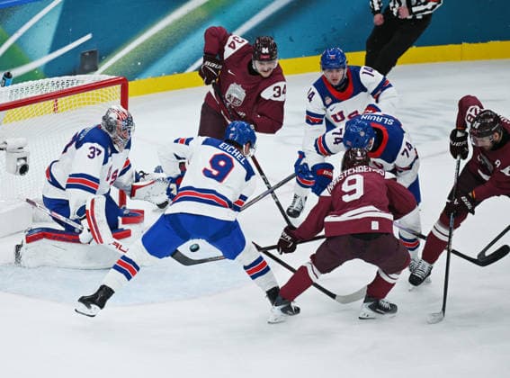 (260213) -- MILAN, Feb. 13, 2026 -- Renars Krastenbergs (2nd, R) of Latvia scores a goal during the Ice hockey, Eishockey men s preliminary round group C match between the United States and Latvia at the Milan-Cortina 2026 Olympic Winter games, Winterspiele,Spiele, Summer games in Milan, Italy, Feb. 12, 2026. ) (MICO2026)ITALY-MILAN-OLYMPIC WINTER GAMES-ICE HOCKEY-MEN-PRELIMINARY-USA VS LAT ZhangxHaofu 