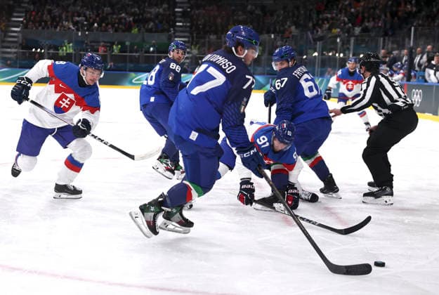(260213) -- MILAN, Feb. 13, 2026 -- Matus Sukel (C) of Slovakia competes against Gregory di Tomaso (3rd L) of Italy during the Ice hockey, Eishockey men s preliminary round group B match between Italy and Slovakia at the Milan-Cortina 2026 Olympic Winter games, Winterspiele,Spiele, Summer games in Milan, Italy, Feb. 13, 2026. ) (MICO2026)ITALY-MILAN-OLYMPIC WINTER GAMES-ICE HOCKEY-MEN-PRELIMINARY-ITA VS SVK WangxKaiyan 