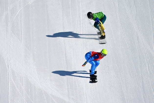 XXV Winter Olympic Games, Olympische Spiele, Olympia, OS in Livigno, Italy, on February 13, 2026. Snowboard Women s Snowboard Cross, 1 8 Finals. Michela Moioli of Italy (in red) and Mia Clift of Australia (in green). (CTKxPhoto DavidxTanecek) CTKPhotoP2026021305333  CTKPhotoP2026021305333