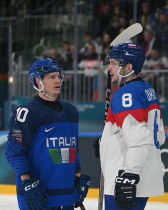 GAZLEY Dustin (ITA) and OKULIAR Oliver (SVK) talking during Men s Ice hockey, Eishockey - Italia vs Slovacchia, Olympic Winter games, Winterspiele,Spiele, Summer games Milano-Cortina 2026 in Milano, Italy, February 13 2026  Copyright: xFilippoxTomasi IPAxSportx xipa-agency.netx xx IPA_71430617 IPA_Agency_IPA71430617