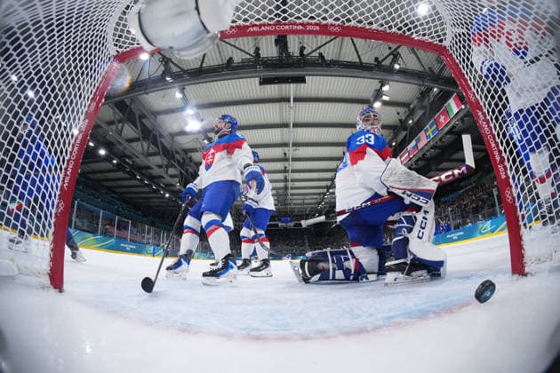 (260213) -- MILAN, Feb. 13, 2026 -- Stanislav Skorvanek (R), goalkeeper of Slovakia, fails to make a save during the Ice hockey, Eishockey men s preliminary round group B match between Italy and Slovakia at the Milan-Cortina 2026 Olympic Winter games, Winterspiele,Spiele, Summer games in Milan, Italy, Feb. 13, 2026. ( Pool via Xinhua) (MICO2026)ITALY-MILAN-OLYMPIC WINTER GAMES-ICE HOCKEY-MEN-PRELIMINARY-ITA VS SVK WangxKaiyan 