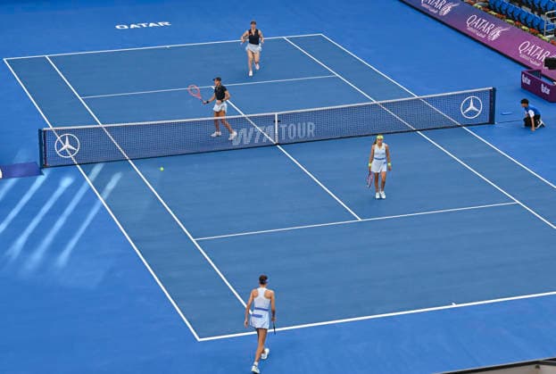 WTA, Tennis Damen QATAR OPEN 2026-DOUBLES SEMIFINAL Gabriela Dabrowski of Canada and Luisa Stefani of Brazil (top) seen in action during their Women s doubles semifinal match against Anna Danilina of Kazakhstan and Aleksandra Krunic of Serbia (not in view) at the WTA Qatar TotalEnergies Open 2026 tennis tournament at the Khalifa International Tennis Complex in Doha, Qatar, on February 13, 2026. ¨¨ DOHA Qatar Copyright: xNOUSHADx