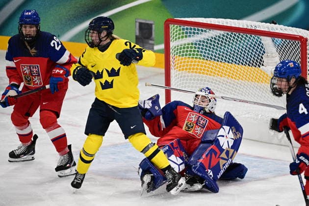 XXV Winter Olympic Games, Olympische Spiele, Olympia, OS in Milan, Italy, on February 13, 2026. Ice hockey, Eishockey - women, quarterfinals: Czech Republic vs Sweden. From left: Noemi Neubauerova (CZE), Thea Johansson (SWE), goalkeeper Klara Peslarova (CZE) and Daniela Pejsova (CZE). (CTKxPhoto MichalxKamaryt) CTKPhotoP2026021309202  CTKPhotoP2026021309202
