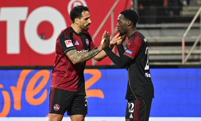 13 02 2026 Soccer Season 2025 2026 2 Soccer Bundesliga 22 Matchday 1 FC Nürnberg FCN Club Karlsruher SC KSC Sportfoto Zink xwoxzix DFL regulations prohibit any use of photographs as image sequences and or quasi video only for editorial use Adriano Grimaldi 33, 1 FC Nürnberg FCN Rabby Nzingoula 22, 1 FC Nürnberg FCN klatschen ab