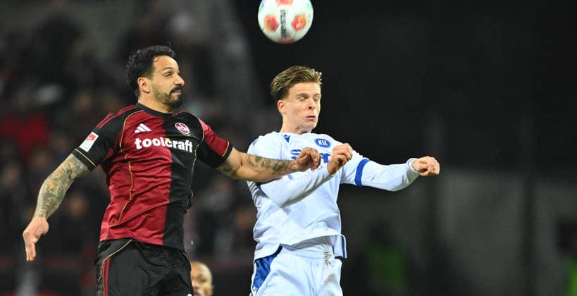 13 02 2026 Soccer Season 2025 2026 2 Soccer Bundesliga 22 Matchday 1 FC Nürnberg FCN Club Karlsruher SC KSC Sportfoto Zink xwoxzix DFL regulations prohibit any use of photographs as image sequences and or quasi video only for editorial use Adriano Grimaldi 33, 1 FC Nürnberg FCN in header duel with Dzenis Burnic 7, Karlsruher SC KSC