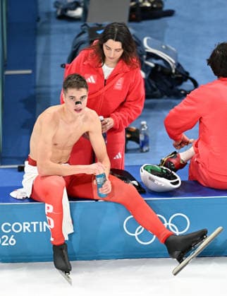 (260213) -- MILAN, Feb. 13, 2026 -- Vladimir Semirunniy (L) of Poland takes a break after the Speed skating, Eisschnelllauf men s 10000m event at the Milan-Cortina 2026 Olympic Winter games, Winterspiele,Spiele, Summer games in Milan, Italy, Feb. 13, 2026. ) (MICO2026)ITALY-MILAN-OLYMPIC WINTER GAMES-SPEED SKATING-MEN S 10000M WuxWei 