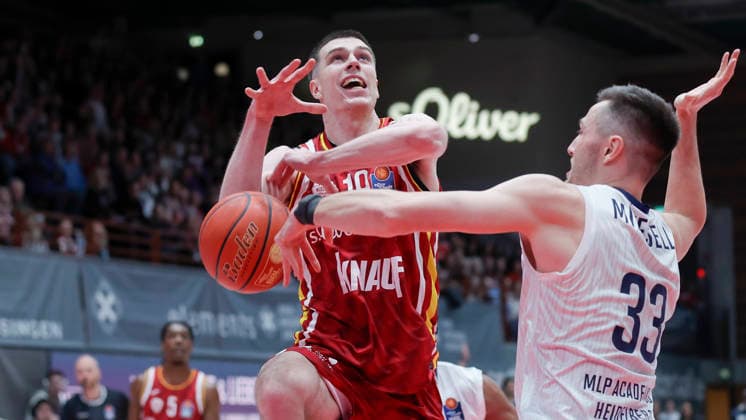 In the picture from left Christian Skladanowski Wuerzburg Baskets, 19 against Ryan Mikesell MLP Academics Heidelberg, 33 13 02 2026, Fitness First Wuerzburg Baskets vs MLP Academics Heidelberg, easyCredit BBL, Matchday 20, Germany, 97072, tectake Arena Wuerzburg, Copyright: HMBxMedia xJulienxBecker