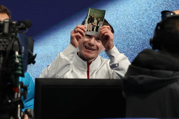 February 13, 2026, Milan, Lombardy, Italy: MAXIM NAUMOV of USA holds a photo of his parents Evgenia Shishkova and Vadim Naumov that he both lost in a midair plane crash over the Potomac River near Washington, DC. Milan Italy - ZUMAc179 20260213_oly_c179_200 Copyright: xMickaelxChavetx