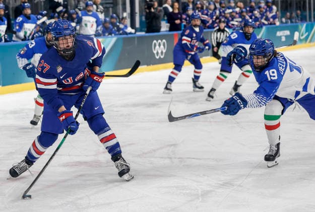 United States Taylor Heise (27) passes around Italy s Kristin Della Rovere (19) during the Women s Playoff Quarterfinal game between Italy and the USA at the Milano Rho Ice hockey, Eishockey Arena in Milan, Italy, on Friday, February 13, 2026.  OLY202602138604 AARONxJOSEFCZYK