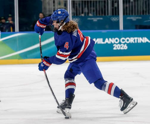 United States Caroline Harvey (4) shoots in the second period of the Women s Playoff Quarterfinal game between Italy and the USA at the Milano Rho Ice hockey, Eishockey Arena in Milan, Italy, on Friday, February 13, 2026.  OLY202602138621 AARONxJOSEFCZYK