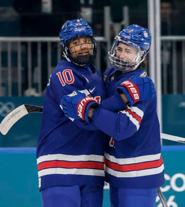 United States Laila Edwards (10) celebrates scoring a goal with United States Megan Keller (5) in the second period of the Women s Playoff Quarterfinal game between Italy and the USA at the Milano Rho Ice hockey, Eishockey Arena in Milan, Italy, on Friday, February 13, 2026.  OLY202602138620 AARONxJOSEFCZYK