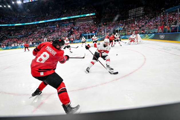 MILAN, ITALY - FEBRUARY 13: Cale Makar of Canada takes a shot while Roman Josi of Switzerland tries to stop it during the Men™s Prelim Round match between Canada and Switzerland on day seven of the Milano Cortina 2026 Winter Olympic Games, Olympische Spiele, Olympia, OS at Milano Santagiulia IHO Arena on February 13, 2026 in Milan, Italy. Milan Milano Santagiulia IHO Arena Italy *** MILAN, ITALY FEBRUARY 13 Cale Makar of Canada takes a shot while Roman Josi of Switzerland tries to stop it during the Men™s Prelim Round match between Canada and Switzerland on day seven of the Milano Cortina 2026 Winter Olympic games at Milano Santagiulia IHO Arena on February 13, 2026 in Milan, Italy Milan Milano Santagiulia IHO Arena Italy Copyright: xJustPictures.ch AndreaxBrancax jp-en-EuSpIm-AB-DSC_113813022026