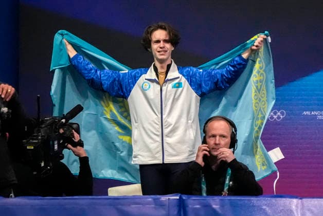 Mikhail Shaidorov of Kazakhstan celebrates after learning he won gold during the Men s Single Figure skating, Eiskunstlauf Final at the Milano Figure Skating Arena in Milan, Italy on Friday, February 13, 2026. Yuma Kagiyama of Japan won silver and Shun Sato of Japan won bronze.  OLY20260213464 RICHARDxELLIS